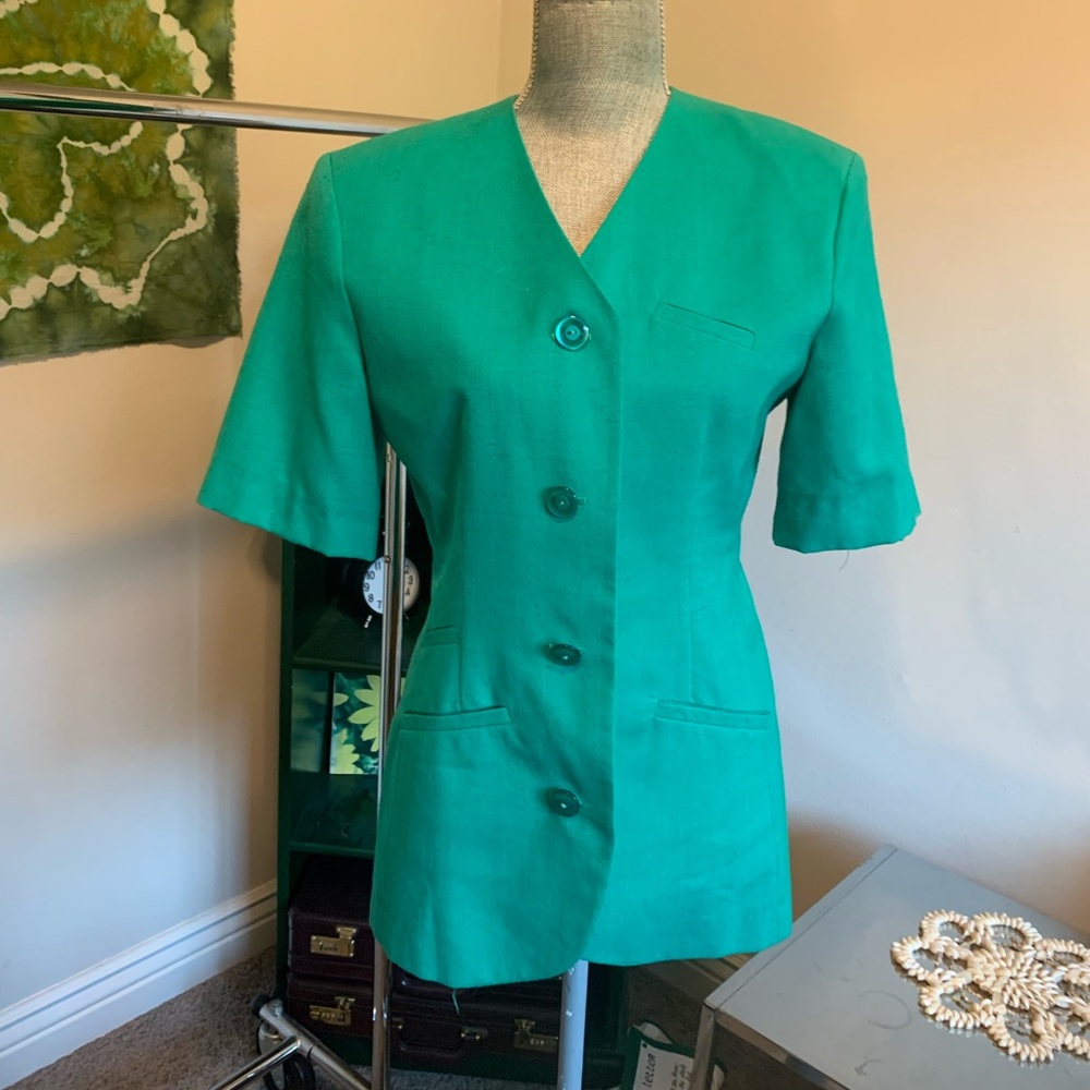 Retro Check Point teal shirt with shoulder pads. 

This top was made in the USA.